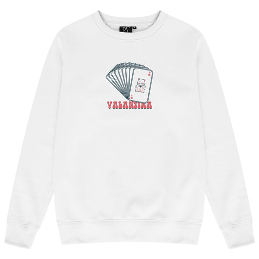 White oversized women’s sweatshirt featuring a bold multi-card inspired graphic print on the chest, classic crew neckline, and long ribbed sleeves.