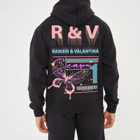 Rear view of male model wearing black oversized hoodie with coral butterfly graphic and R&V print – oversized fit.