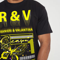 Male model front view wearing a black Yellow Butterfly Oversized T-shirt with vivid yellow butterfly graphic, styled with casual black shorts – oversized fit.