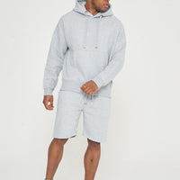 Side view of model walking in grey oversized hoodie - 365 Collection.