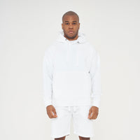 Full-body front view of model wearing men's white oversized hoodie, 365 Collection.