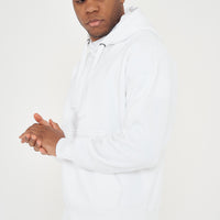 Model posing in men's white oversized hoodie with hands clasped, 365 Collection.