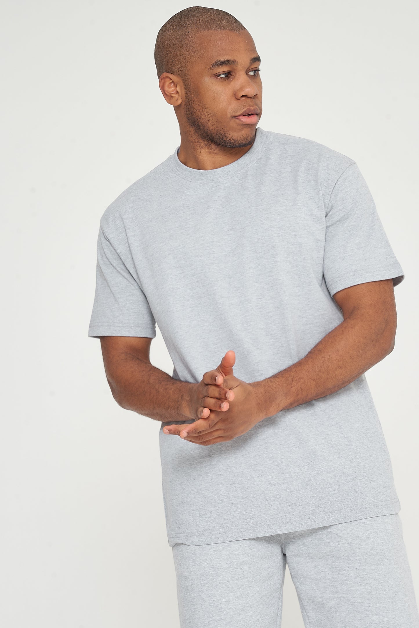 Close-up of model wearing grey 365 Oversized T-Shirt – men’s loose fit cotton tee for daily comfort.