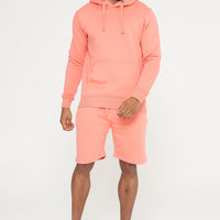 Male model front view wearing coral 365 Regular Hoodie and matching shorts – regular fit, 365 Collection.