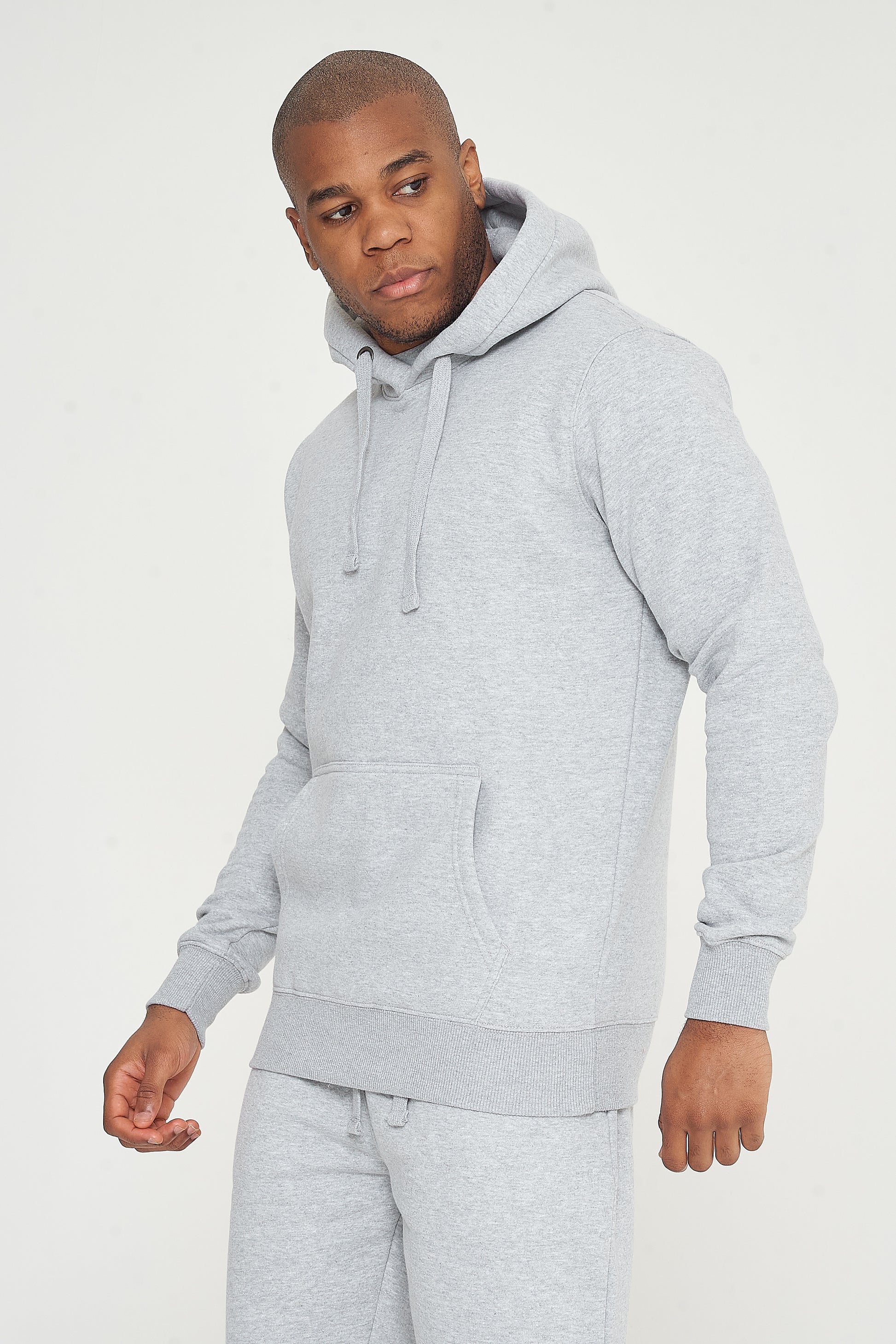 Side view of model in grey 365 Regular Hoodie - classic pullover hoodie for everyday wear.