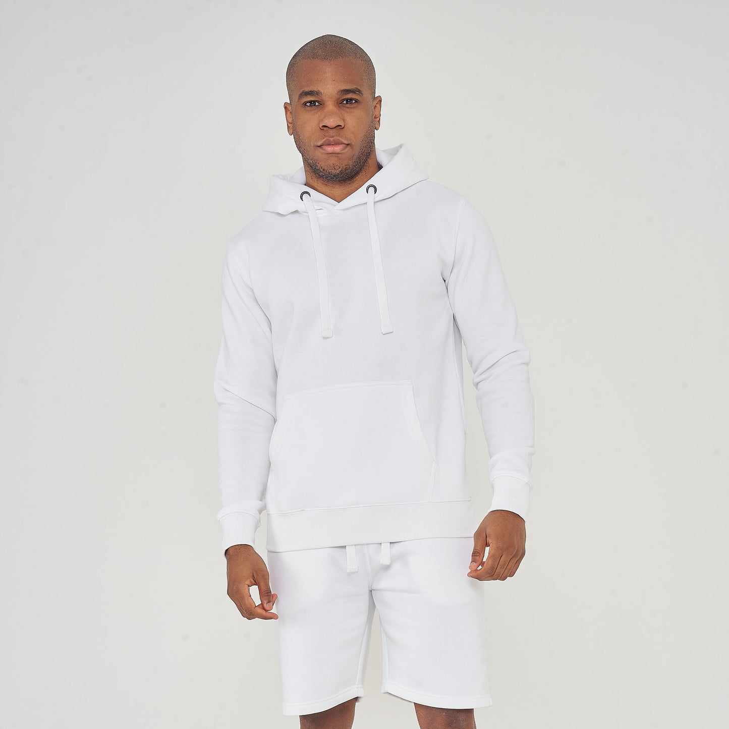 Full-body front view of model wearing men’s white regular-fit hoodie – 365 Collection.