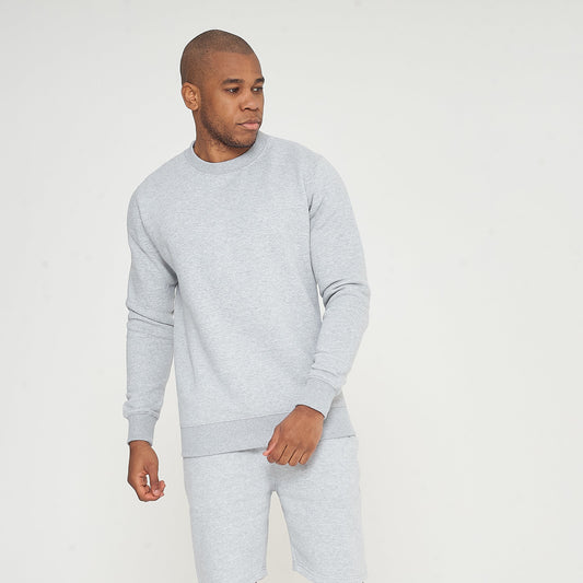 Model in grey regular-fit sweatshirt looking sideways in standing pose - 365 Collection.
