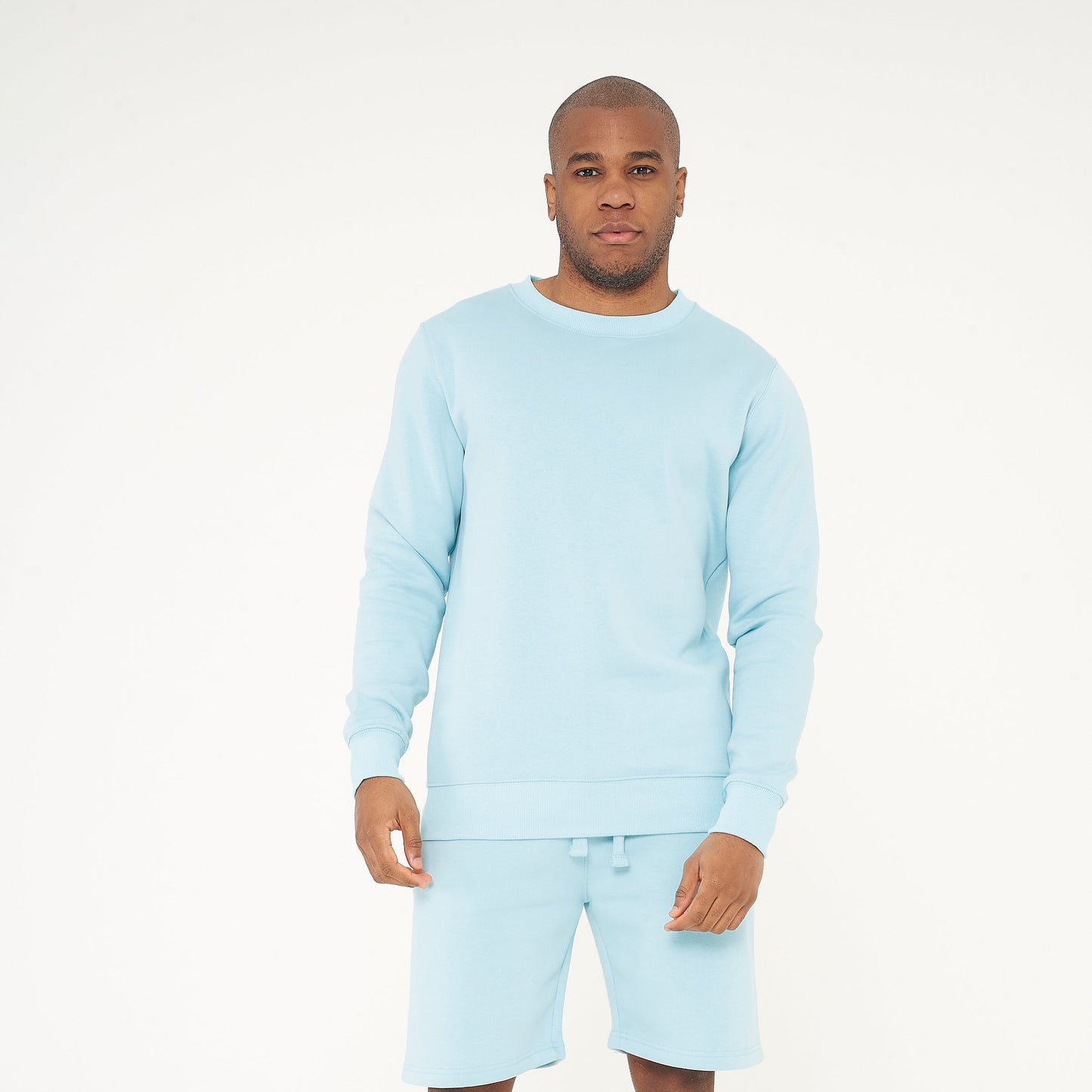 Full-body front view of model wearing turquoise regular-fit sweatshirt - 365 Collection.