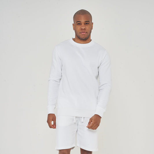 Full-body front view of male model wearing white oversized sweatshirt – 365 Collection.