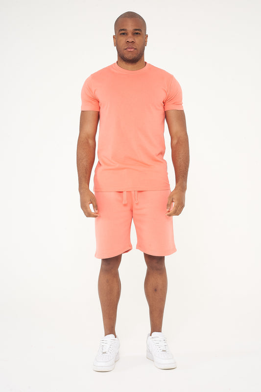Male model front view wearing coral 365 Regular T-shirt and matching shorts, hands relaxed – 365 Collection – regular fit.
