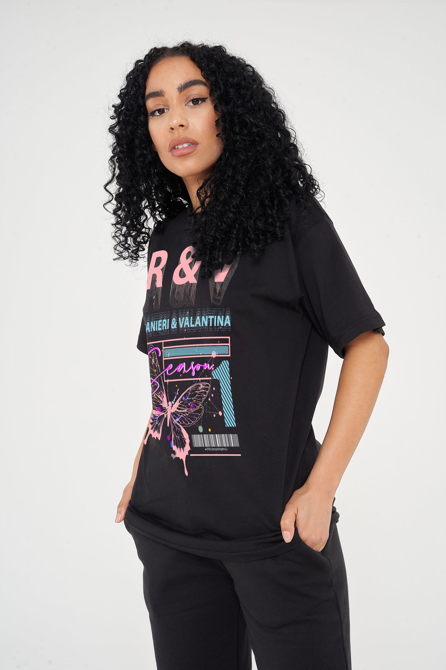 Back view of oversized pink Butterfly Season One graphic t-shirt showing relaxed fit.