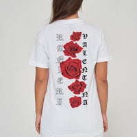 Woman wearing the white Gothic Roses Oversized T-Shirt styled with casual bottoms, highlighting the dramatic back floral print and comfortable relaxed fit.