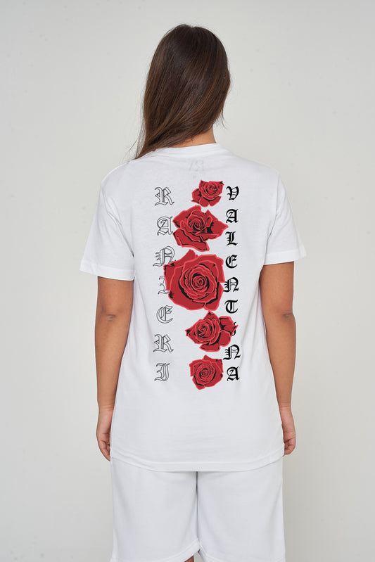 Woman wearing the white Gothic Roses Oversized T-Shirt styled with casual bottoms, highlighting the dramatic back floral print and comfortable relaxed fit.