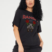Woman wearing the Guns & Roses Oversized T-Shirt styled with black jeans, highlighting the bold front graphic and comfortable oversized fit.