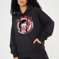 Woman wearing the Japanese Lady Season 1 Hoodie in black styled with casual bottoms, highlighting the front graphic, oversized fit, and hoodie details.
