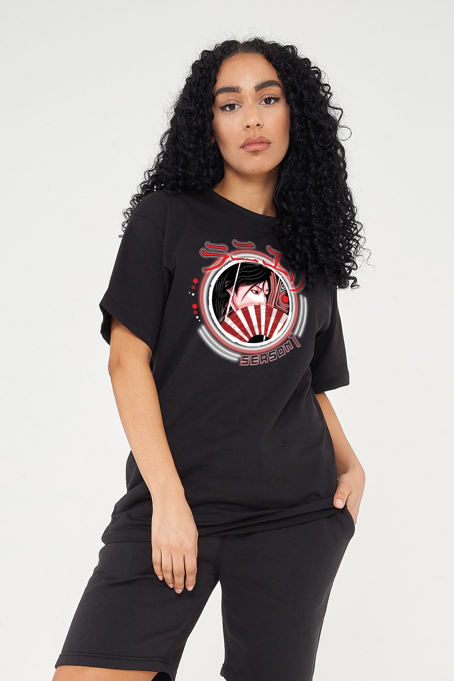Woman wearing the Japanese Lady Season 1 Oversized T-Shirt styled with high-waisted jeans, highlighting the bold front graphic and relaxed oversized fit.