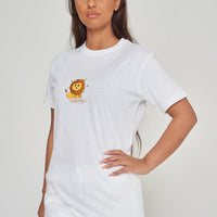 Woman wearing the white Lion Graphic T-Shirt styled with casual bottoms, highlighting the bold front lion graphic and comfortable oversized fit. 