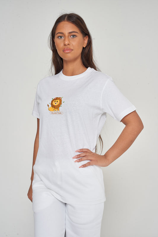 Woman wearing the white Lion Graphic T-Shirt styled with casual bottoms, highlighting the bold front lion graphic and comfortable oversized fit. 