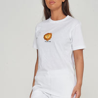 Woman wearing the white Lion Head Graphic T-shirt styled with casual bottoms, highlighting the prominent front lion head print and comfortable oversized fit.
