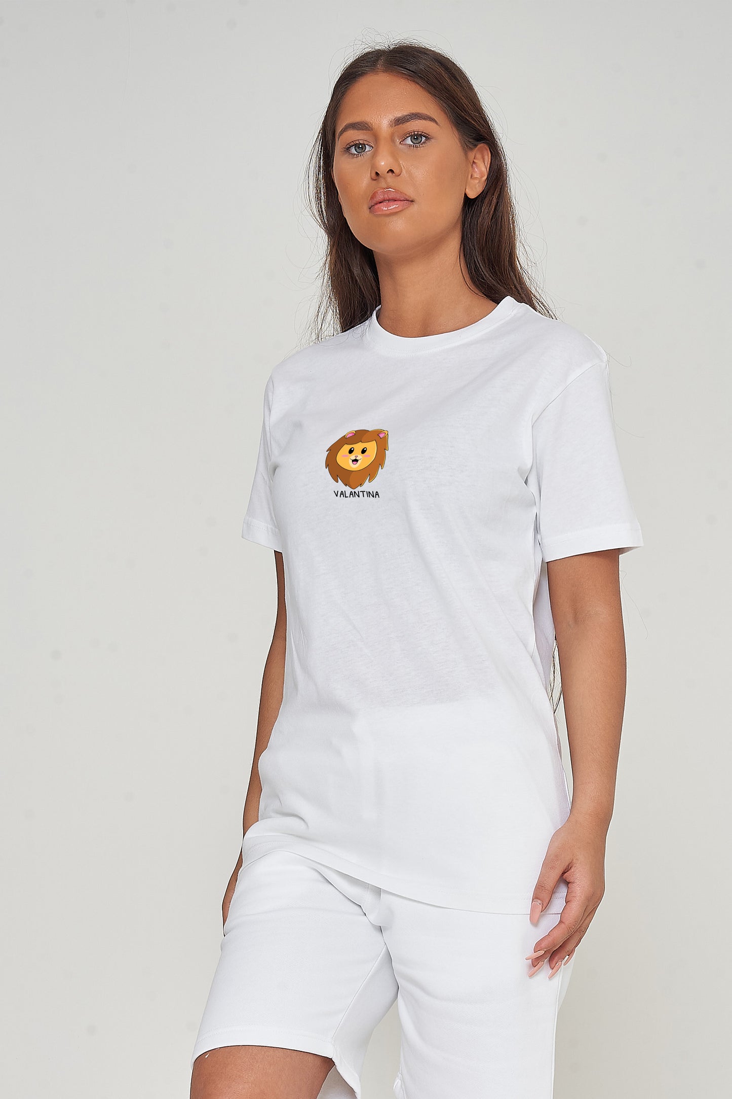 Woman wearing the white Lion Head Graphic T-shirt styled with casual bottoms, highlighting the prominent front lion head print and comfortable oversized fit.