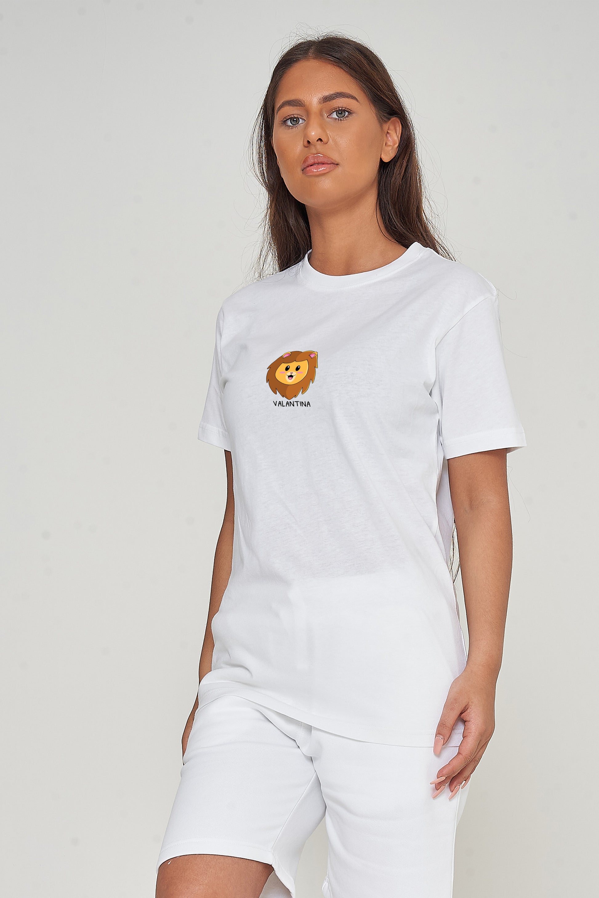 Woman wearing the white Lion Head Graphic T-shirt styled with casual bottoms, highlighting the prominent front lion head print and comfortable oversized fit.
