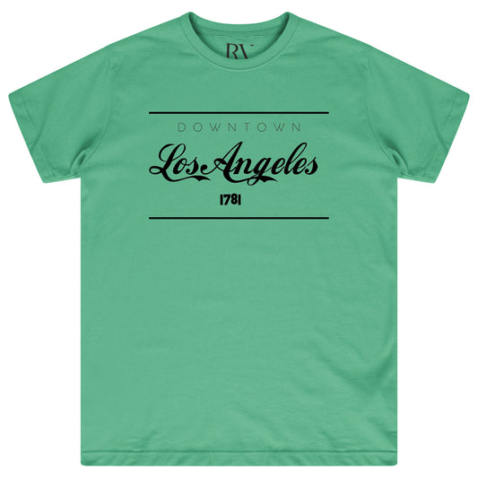 Green oversized women’s T-shirt featuring a bold white “Los Angeles” graphic printed prominently on the chest, classic round neckline, and short sleeves.