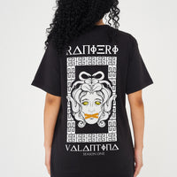 Woman wearing the Medusa Oversized T-Shirt styled with casual bottoms, highlighting the dramatic back graphic and comfortable oversized fit.