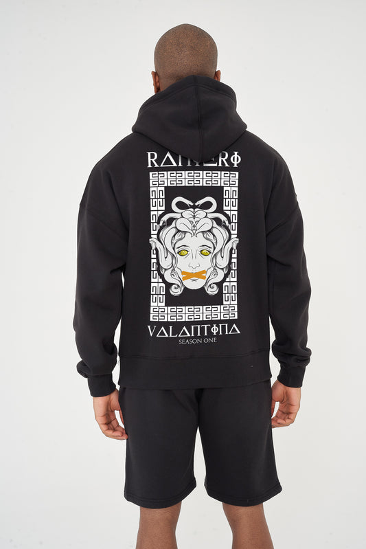 Male model rear view wearing black Medusa Season One Oversized Hoodie with Medusa graphic – oversized fit.