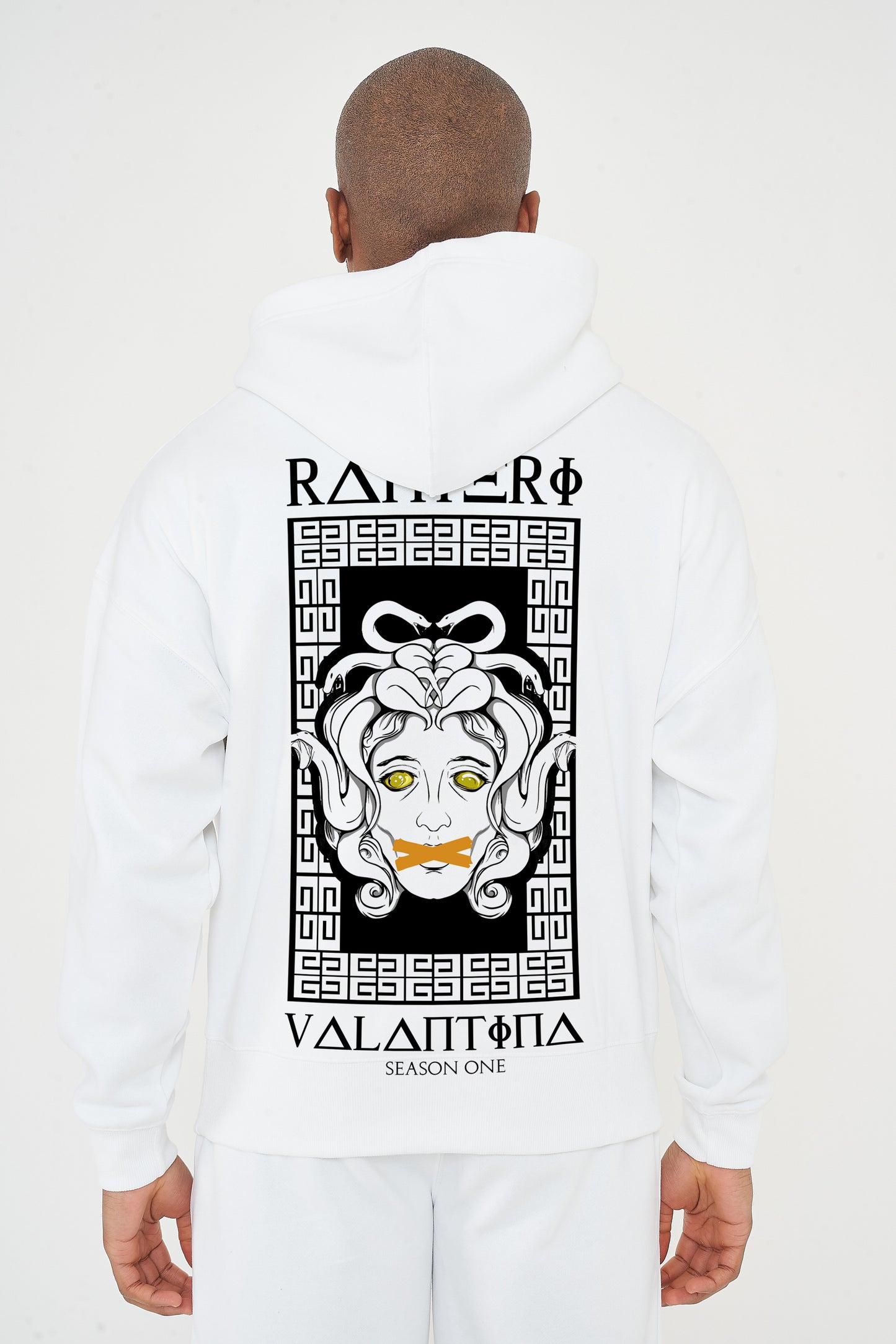Male model rear view wearing white Medusa Season One Oversized Hoodie with bold Medusa graphic – oversized fit.
