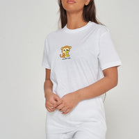 Woman wearing the white Monkey Graphic T-Shirt styled with casual bottoms, highlighting the prominent front monkey print and comfortable oversized fit. 