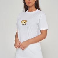 Woman wearing the white Monkey Head T-Shirt styled with casual bottoms, highlighting the prominent front monkey head graphic and comfortable oversized fit. 