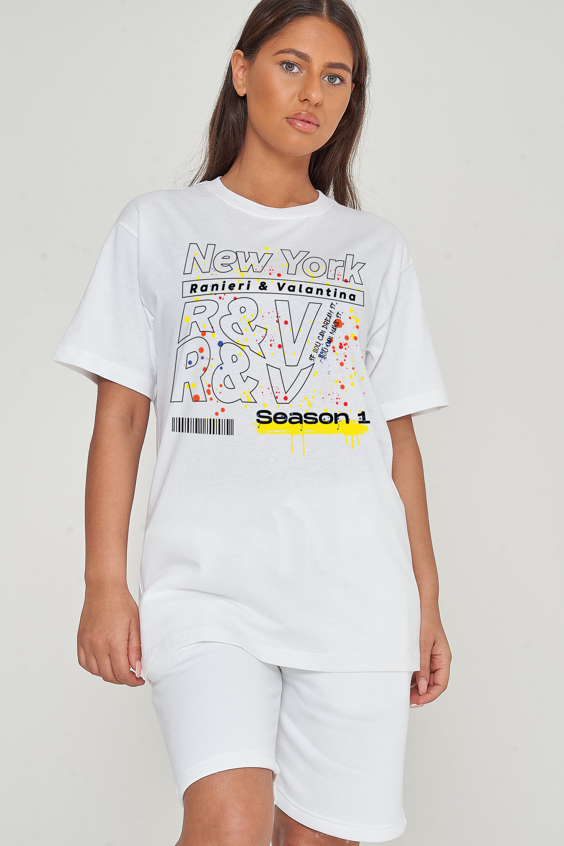 Woman wearing the New York Season 1 Oversized T-Shirt styled with casual bottoms, emphasizing the bold graphic print and comfortable oversized fit.