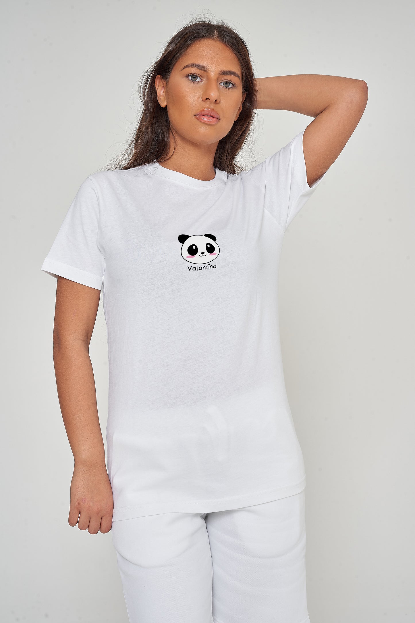 Woman wearing the white Panda Head Graphic T-Shirt styled with casual bottoms, emphasizing the bold front panda head print and comfortable oversized fit. 