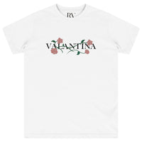 White oversized T-shirt featuring a bold pink rose vine print across the chest with crew neckline.