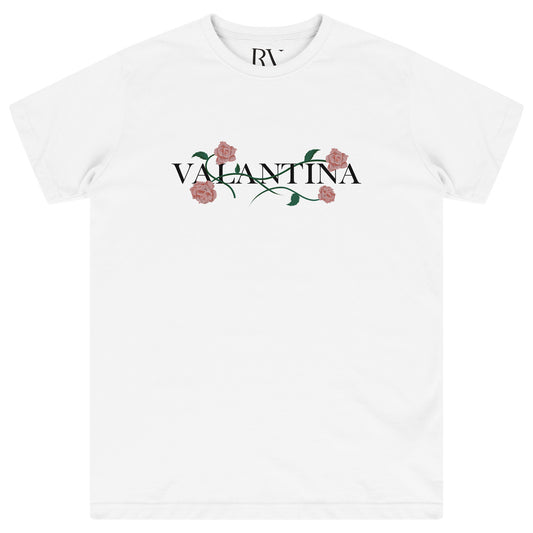 White oversized T-shirt featuring a bold pink rose vine print across the chest with crew neckline.