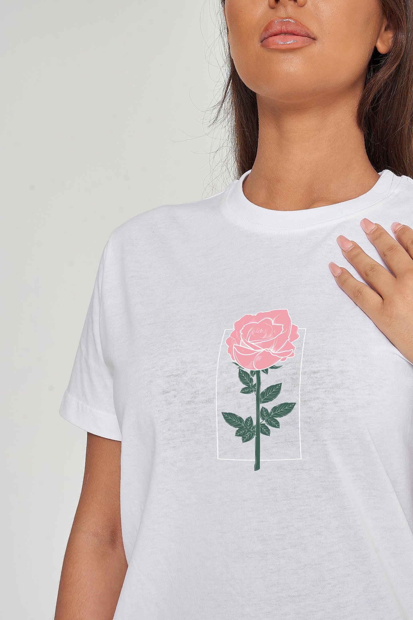 Woman wearing the Plain Rose Oversized T-Shirt styled with casual bottoms, highlighting the subtle front rose print and relaxed comfortable fit.
