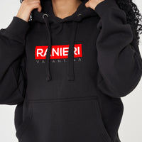 Woman wearing the black Red Box Oversized Hoodie styled with casual bottoms, highlighting the striking front red box print and comfortable, relaxed silhouette.