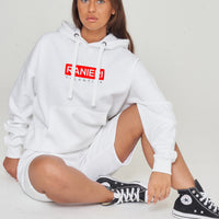 Person wearing the white Red Box Oversized Hoodie styled with casual bottoms, highlighting the front red box print and comfortable oversized silhouette. 