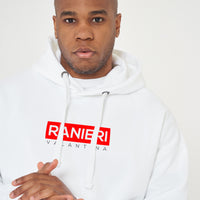 Person wearing the white Red Box Oversized Hoodie styled with casual bottoms, highlighting the front red box print and comfortable oversized silhouette.