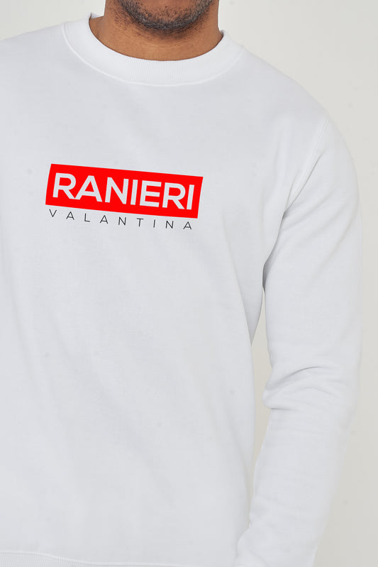 Person wearing the white Red Box Sweatshirt styled with casual bottoms, highlighting the front red box graphic and comfortable fit.