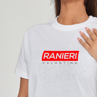 Woman wearing the white Red Box T-Shirt styled with casual bottoms, highlighting the striking front red box print and comfortable fit.