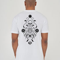 Man wearing the white Skull Tattoo Oversized T-Shirt styled with casual bottoms, showcasing the striking back graphic and comfortable oversized fit.