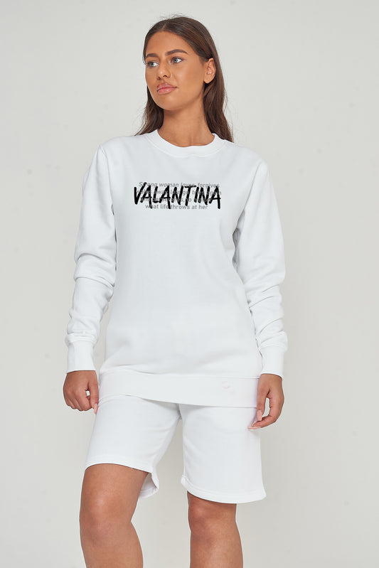 Person wearing the white Strong Woman sweatshirt styled with casual bottoms, highlighting the inspiring front graphic and comfortable fit.