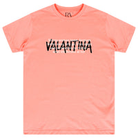 Coral oversized Strong Women T-Shirt featuring bold white “STRONG WOMEN” text on the front and a crew neckline.