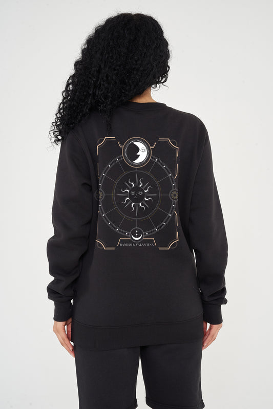 Flat lay image: Laid-flat black sweatshirt showing the clean front, round neckline, ribbed trims, long sleeves, and relaxed fit silhouette.