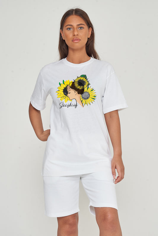 Woman wearing the white Sunflower Girl Oversized T-Shirt styled with casual bottoms, highlighting the front sunflower graphic and comfortable fit.