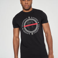 Male model front view wearing black Unseen Oversized T-shirt with circular front graphic, styled with casual shorts – oversized fit.