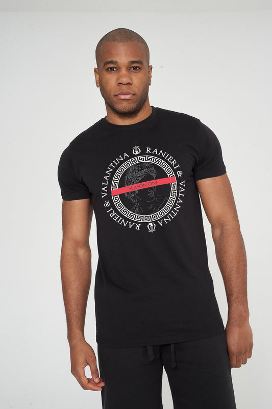 Male model front view wearing black Unseen Oversized T-shirt with circular front graphic, styled with casual shorts – oversized fit.