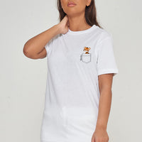 Woman wearing the white Tiger Pocket T-Shirt styled with casual bottoms, highlighting the distinctive front tiger graphic and oversized comfortable fit.