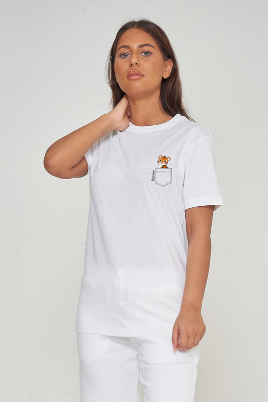 Woman wearing the white Tiger Pocket T-Shirt styled with casual bottoms, highlighting the distinctive front tiger graphic and oversized comfortable fit.